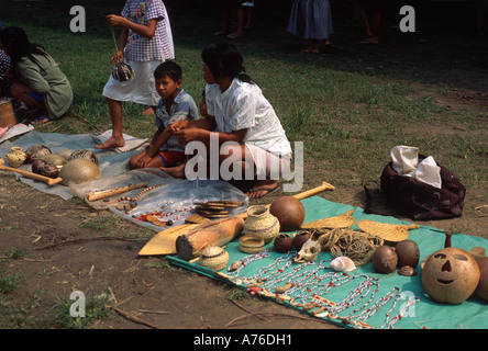 Turtle shell, mollusks, jewelry, carved paddles and masks for sale by local people in Amazon basin
