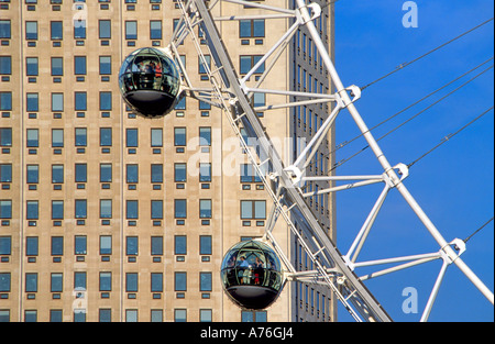 Close up view of the pods on the London Eye with the Shell Tower behind. Stock Photo