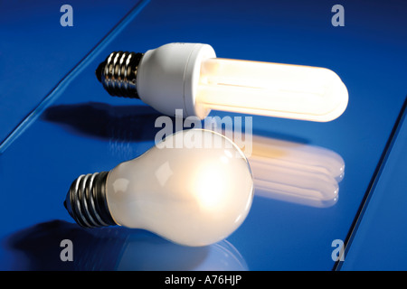 Energy saving lamp and electric bulb, close-up Stock Photo
