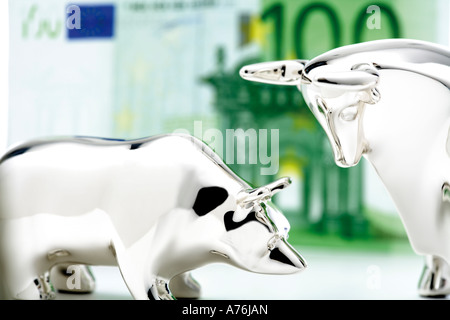 Bull and bear figurine, euro banknote in background, close-up Stock Photo