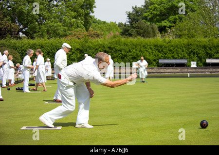 A view of the green with a male team member as he bowls. Stock Photo