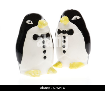 Penguin in tuxedo china salt and pepper shakers on white background Stock Photo