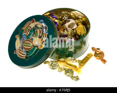 Confectionary in traditional metal sweet tin on white background Stock Photo