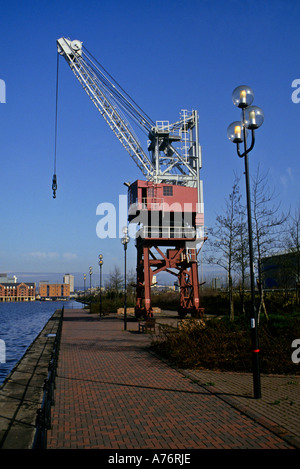 Dockyard crane now on pavement walkway around Atlantic Wharf Cardiff Wales UK Stock Photo