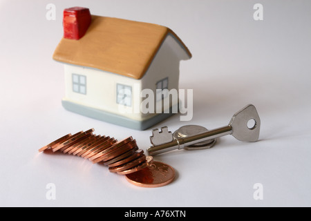 Cost of housing home concept money coin key