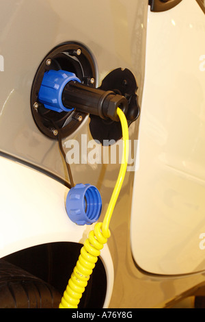 Smart EV electric car being charged up Stock Photo