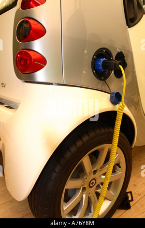 Smart EV electric car being charged up Stock Photo