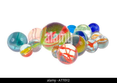 Collection of different sized coloured glass marbles on a pure white background. Stock Photo