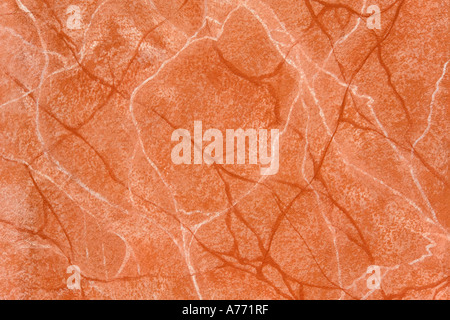 Marbled terracotta paint effects on a wall. Stock Photo