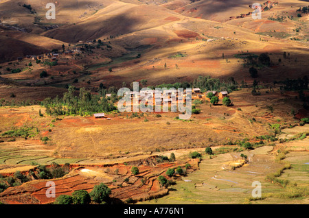 Small village in central highlands of Madagascar with deforested hills and terracing Stock Photo