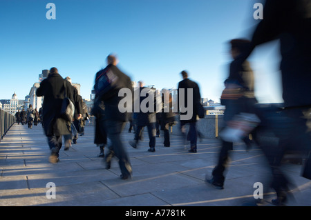 the trudge to work commuters crossing London Bridge on the way to work London England UK NR Stock Photo