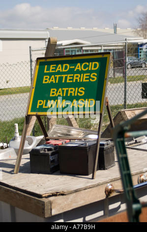 lead acid batteries at community recycling centre aberystwyth ceredigion wales - bilingual welsh english sign UK Stock Photo