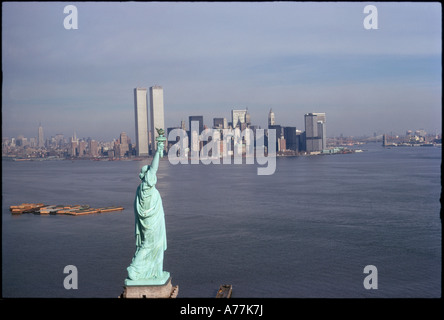 Statue of Liberty Framed Against The World Trade Center Stock Photo