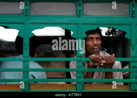 a young man looks to the sky in calcutta Stock Photo