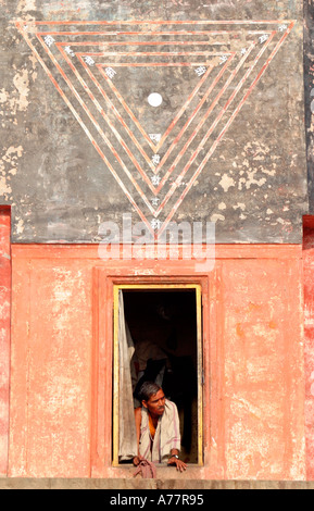 a man looks out his window onto the ganges Stock Photo