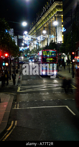 Riding a dubbledecker bus up Oxford Street towards Marble Arch at night Stock Photo