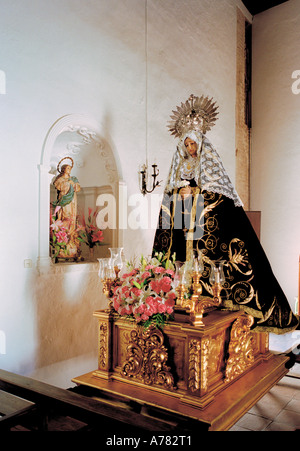 The statue of Our Lady dressed in mourning clothes for Easter processions in the church at Salares, Andalusia, southern Spain Stock Photo