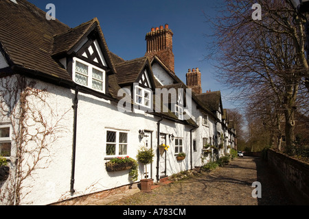 UK Cheshire Vale Royal School Lane Great Budworth cottages beside St Marys Parish church Stock Photo