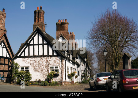 UK Cheshire Vale Royal Great Budworth School Lane cottages beside St Marys Parish church Stock Photo