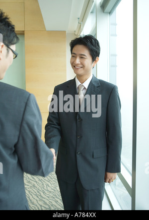 Two businessmen shaking hands Stock Photo