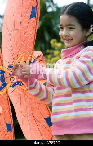 Girl holding kite Stock Photo