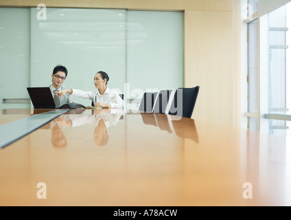 Business executives working in conference room Stock Photo