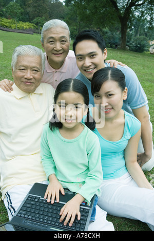 Three generation family with laptop, portrait Stock Photo