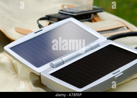 mobile phone solar powered battery charger Stock Photo