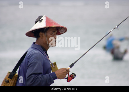 Balinese fishing at Tuban beach Bali Indonesia Stock Photo