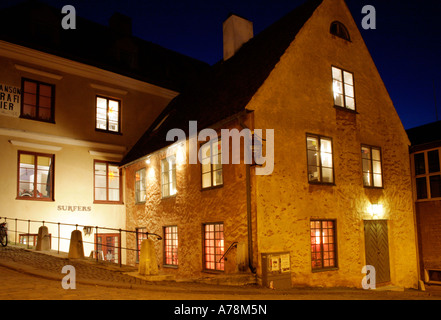 Night view of Surfers a popular inn in Södra Kyrkogatan Road Within the walls of medieval Hanseatic town of Visby Stock Photo
