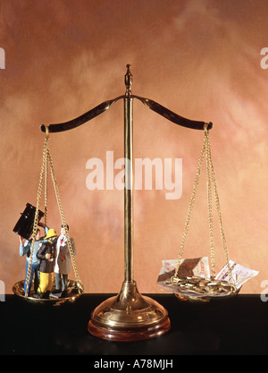 Pan balance set up as a concept image to illustrate the relationship between better public services against tax revenue Stock Photo