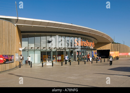 South London entrance Sainsbury supermarket retail business store includes line of bollards to reduce ram raid risk through glass front England UK Stock Photo