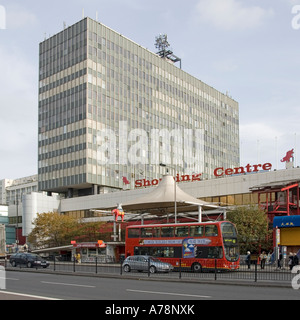 Elephant and Castle Shopping Centre sign with high rise office block & rooftop satellite communications equipment Southwark South London England UK Stock Photo