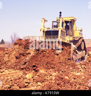 Cat Caterpillar D10 bulldozer preparing a construction site of a new home development Stock Photo