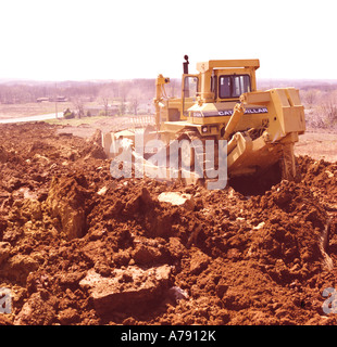 Caterpillar D10 bulldozer at a construction site clearing ground for a development of new homes Stock Photo