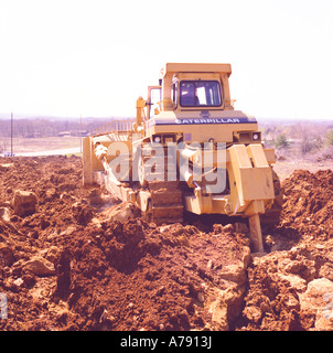 Caterpillar D10 bulldozer at a construction site clearing ground for a development of new homes Stock Photo