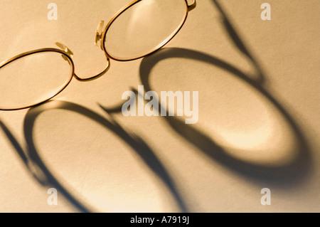 glasses shadow on paper Stock Photo