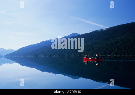 Canoers on Isaac Lake in Bowron Lake Provincial Park BC Stock Photo