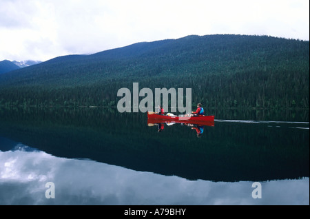 Canoers on Isaac Lake in Bowron Lake Provincial Park BC Stock Photo