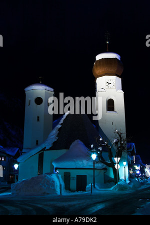 A night shot of St. Anton church in winter, St. Anton am Arlberg, Tirol, Austria Stock Photo