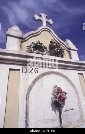 Flowers adorn a mausoleum  in cemetery in  Curacao Netherland Antilles Stock Photo