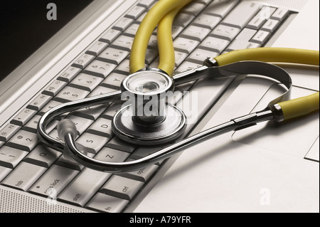 Hospital Doctors Stethoscope On Computer Keyboard Stock Photo