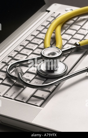 Hospital Doctors Stethoscope On Computer Keyboard Stock Photo
