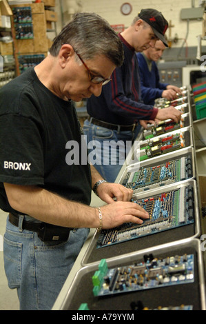 Workers at GAL Elevator Company in the NYC borough of the Bronx Stock Photo