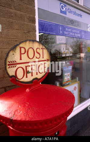 Cheshire Stockport Woodford Post Office sign on top of post box Stock Photo