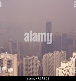 Foggy view from Victoria Peak over Central and Wan Chai Districts with tall Bank of China building Hong Kong Island China Stock Photo
