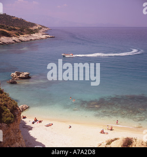 View from cliff top as tourist speed boat leaves white wake in Zingu Beach and bay on Zakynthos Island The Greek Islands Stock Photo
