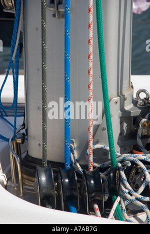 Colour coded halyards on the mast of a large cruising yacht Stock Photo