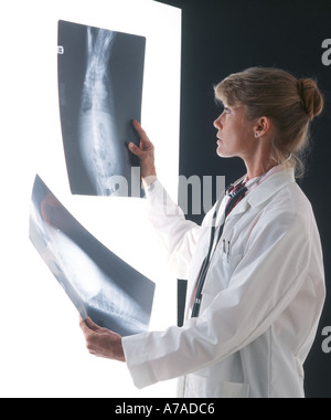 woman doctor checking x rays in lab Stock Photo