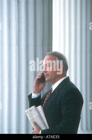 business man talking on cell phone outside his office Stock Photo
